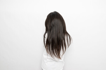 Back view of a little girl with long hair
