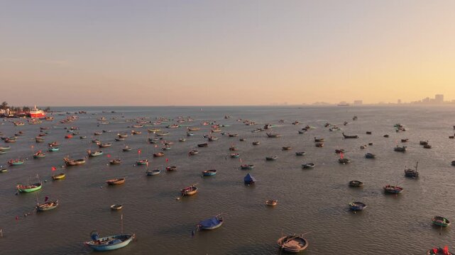 Aerial View Fishing Boats Da Nang Sunset Golden Light Over Crowded Bay, Colorful Coracles And Skiffs, Shimmering Water, Distant Urban Skyline, Boatmen And Tourists, Lively Maritime Activity