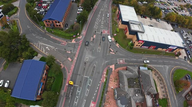 Traffic Junction Overview. Aerial Perspective Of Leeds Crossroads With Vehicles And Cycle Tracks. Aerial Image Of Leeds Junction Featuring Cars Cycling Lanes And Detailed Lane Demarcations