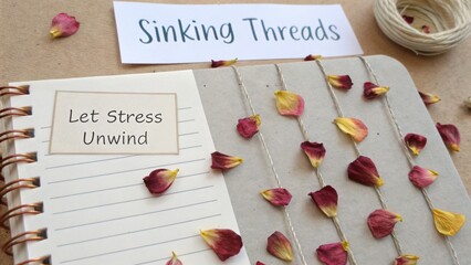 Relaxation and Creative Expression with Let Stress Unwind Journal and Flower Petals on Natural Background