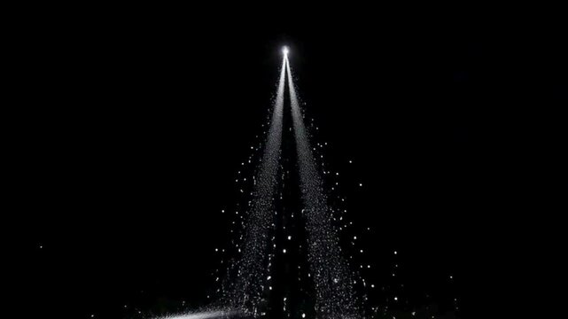 A bright white light beam shines upwards in the dark, creating a sparkling, star-like trail below it. rising video
