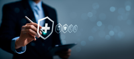 Obraz premium Digital health insurance and medical protection concept with business professional verifying healthcare coverage policy on interface, representing safety, family protection, healthcare benefits