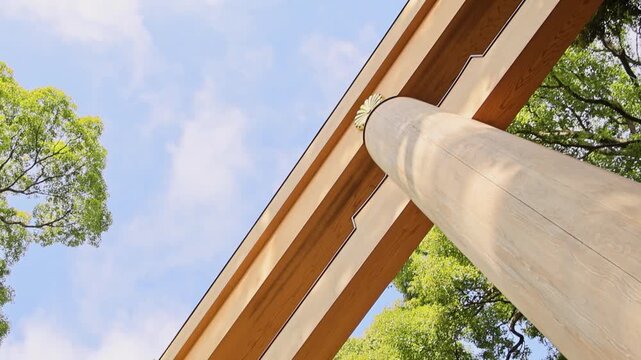 Towering gateway with vast sky and verdant foliage Meiji Shrine