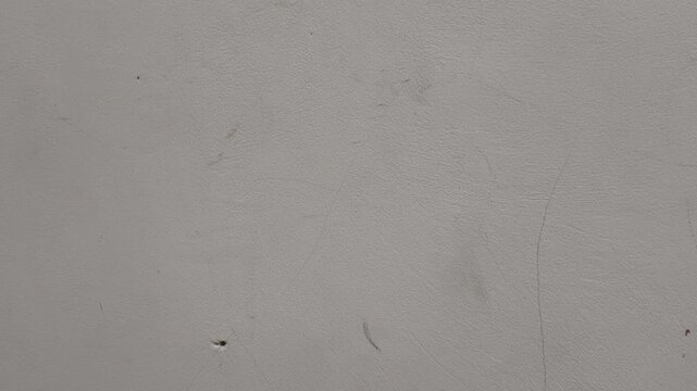 Person Hand Pressing Buttons On Fan Remote Control