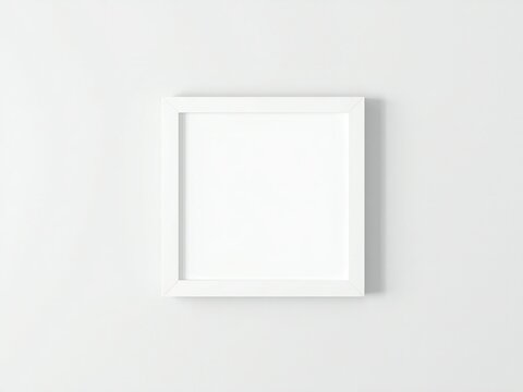 A white picture frame on a white wall