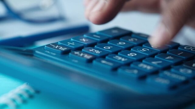 Close up of a person's finger pressing calculator buttons, accounting and financial calculations motion
