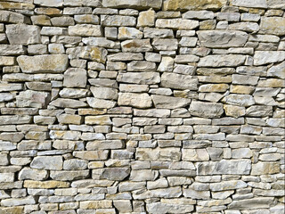 Obraz premium Natural Stone Wall Texture Background with Irregular Stacked Rocks