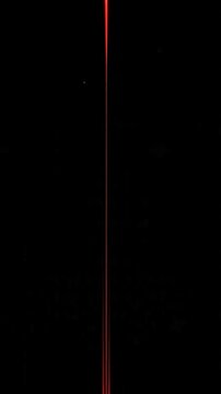 Abstract red line on black background represents futuristic digital concept with glowing lines