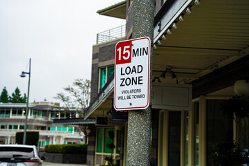 15 Minute Load Zone Sign with Towing Warning for Violators