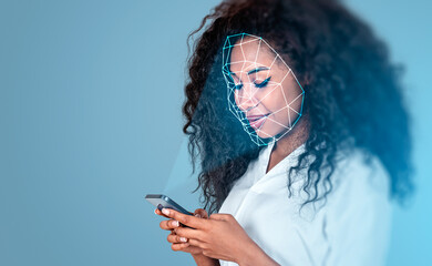 Woman holding smartphone with facial scan overlay in clean digital style on blue background, illustrating modern biometric security concept