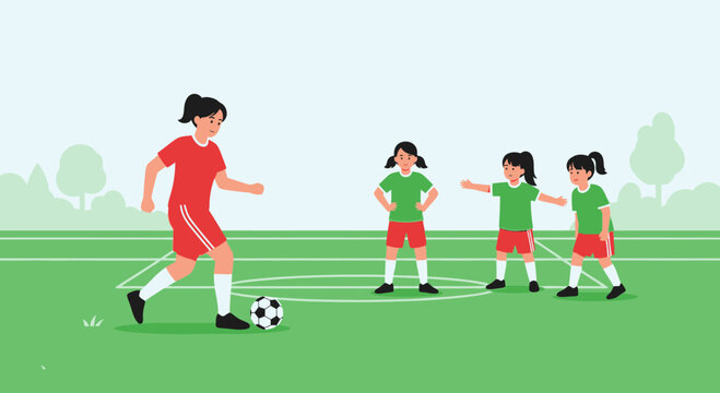 Children's soccer practice: coach teaching girls football on green field with trees