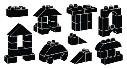 A collection of various black lego building blocks arranged on a white background presented as a silhouette © Komla02