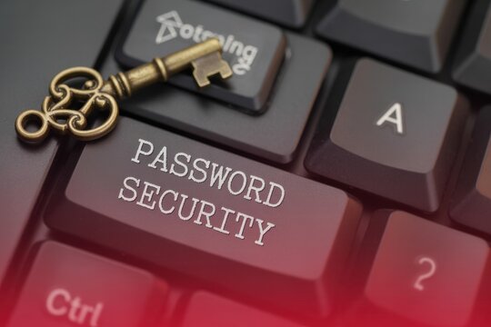 Antique key on a keyboard with "PASSWORD SECURITY" highlighted on a button.