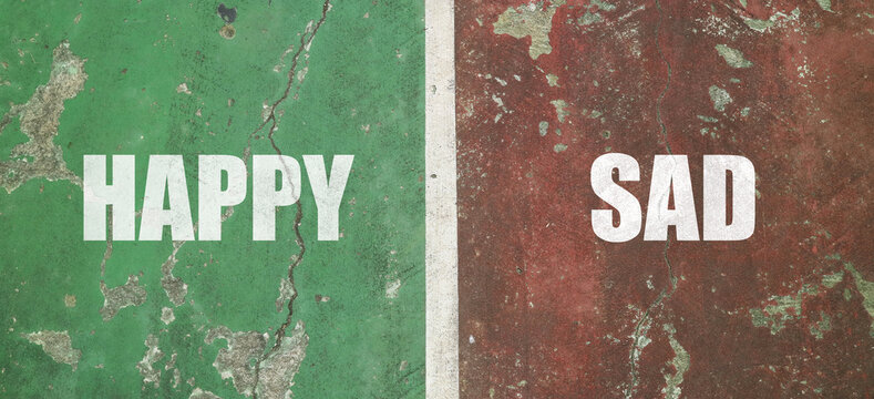 HAPPY and SAD text in white bold font, separated by a white vertical line on a weathered green and red pavement surface.