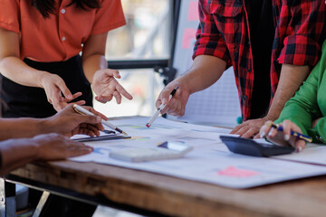 Fototapeta premium In this dynamic business meeting, team members engage passionately, showcasing diverse roles and collaboration while discussing project plans and analytics on the table.