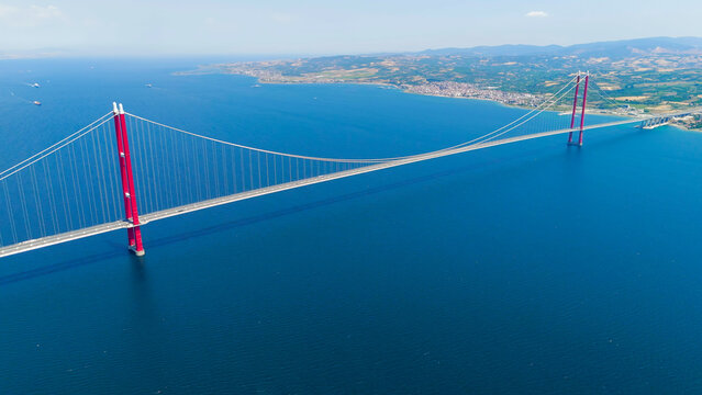 Lapseki, Turkey. Wide aerial view of 1915 Canakkale Bridge with moving cars, the town of Lapseki and the Dardanelles waters. Aerial View