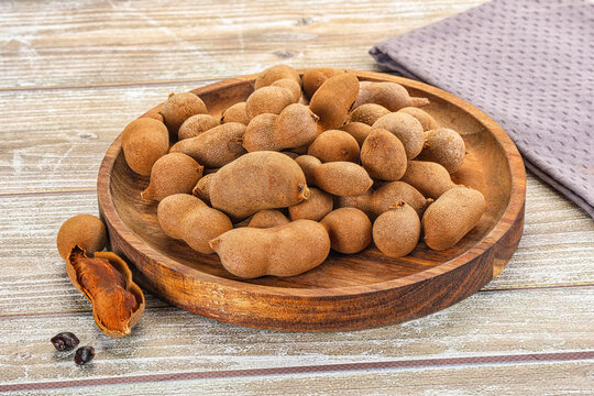Tropical exotic Tamarind fruit heap