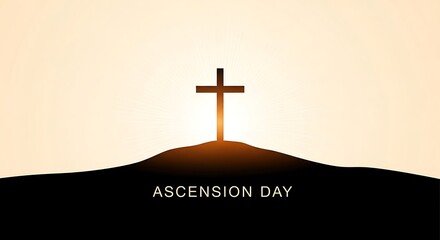 Ascension day cross silhouette on hill at sunrise with glowing light behind it