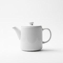 White ceramic teapot with lid and handle