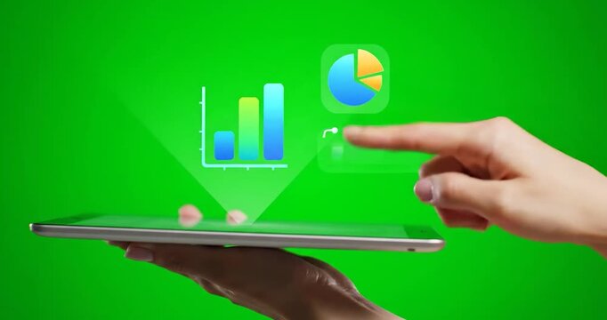 Hand interacting with business analytics charts and pie chart dashboard on green screen tablet interface showing financial data visualization, KPI performance monitoring and data driven decision makin