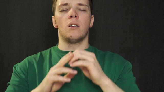 Young man suffering from sore throat and illness at work