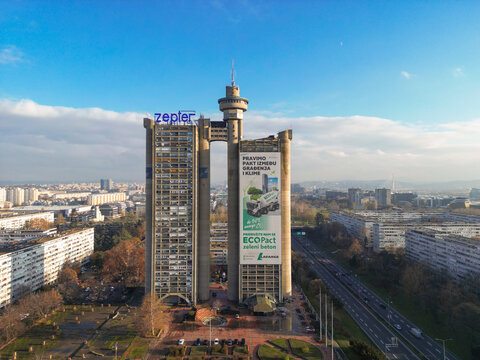 High angle aerial photograph of the Genex Tower and the busy E-75 highway. Drone view showcasing the Western City Gate of Belgrade and the urban traffic flow in Belgrade, Serbia 12.08.2024