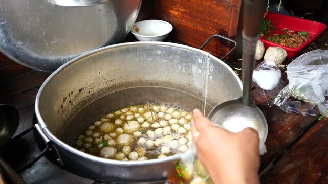 Bakso or baso is an Indonesian meatball, or a meat paste made from beef surimi. Its texture is similar to the Chinese beef ball, fish ball, or pork ball. a meatball stall vendor who prepares a bowl.