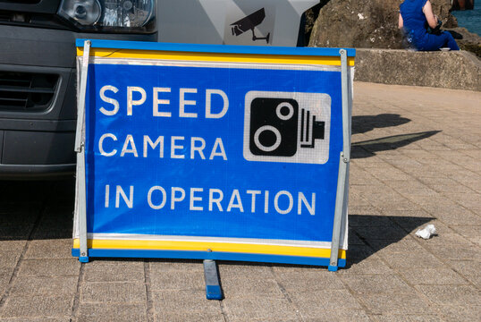 Sign warning of a Speed camera detector van.