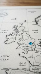 Obraz premium A close-up view of a map shows a blue pin on Europe, highlighting a specific location on the continent's surface.