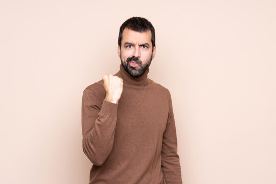 Man over isolated background with angry gesture