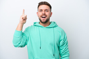Fototapeta premium Young caucasian man isolated on white background intending to realizes the solution while lifting a finger up