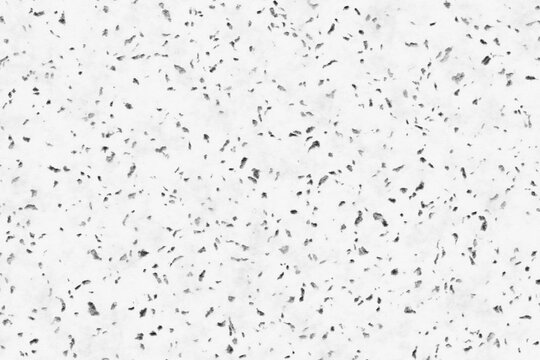 White polished stone surface with black granite chips and speckled texture background illustration.