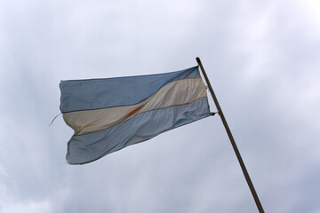 Argentinian flag waving at Iguazu National Park on a cloudy spring day. Photo taken October 7th, 2025, Iguazu National Park, Argentina.