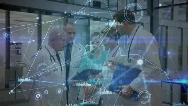 Senior doctor pointing tablet, medical team reviewing holographic data overlay for clinical care