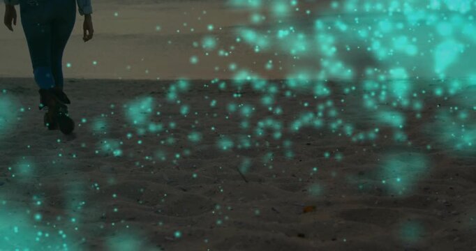 Adult woman stepping in boots and walking to water, teal cloud drifting, obscuring lower legs, tech