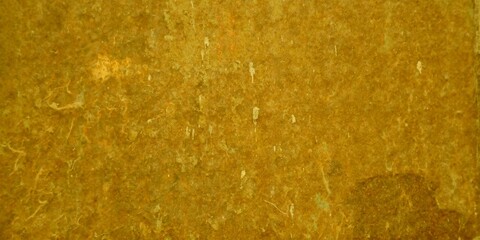 Abstract golden yellow textured background with subtle light variations and rough surface details, ideal for vintage or rustic design projects and web banners