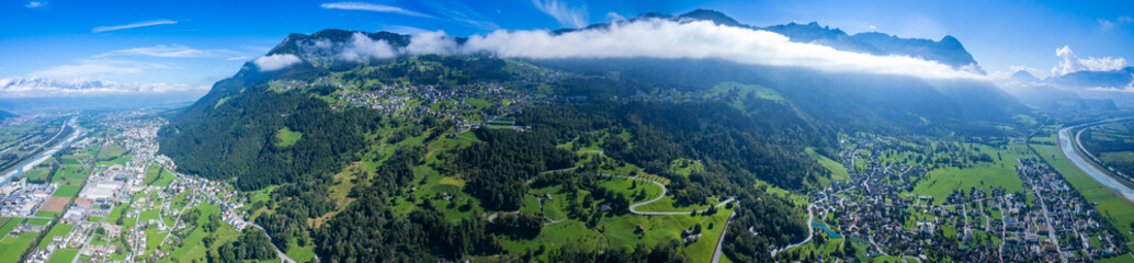 Obraz premium A panorama Aerial view around the city Triesen in Liechtenstein on a sunny day in summer.