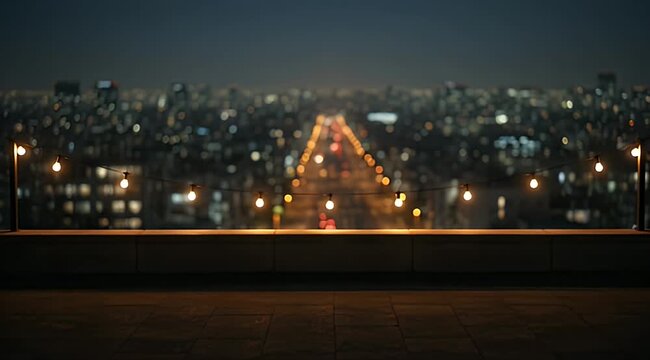 Balcony view of a city skyline at night, with string lights illuminating the foreground
