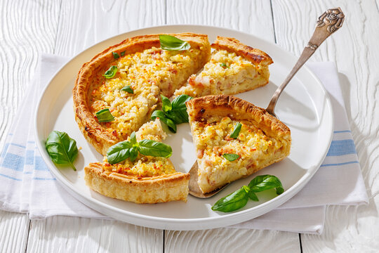Quiche Lorraine on a white plate, top view