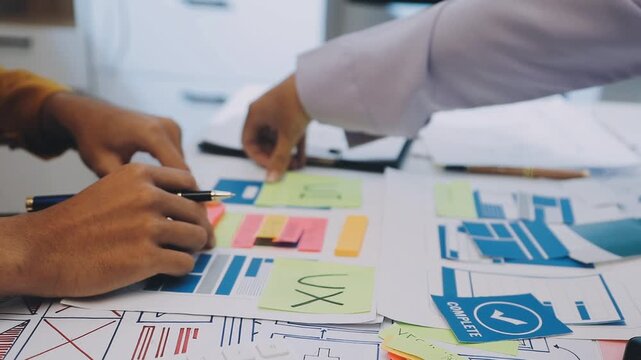 team of UI UX web designer are working together to develop mobile responsive websites with UI UX front end designer previews