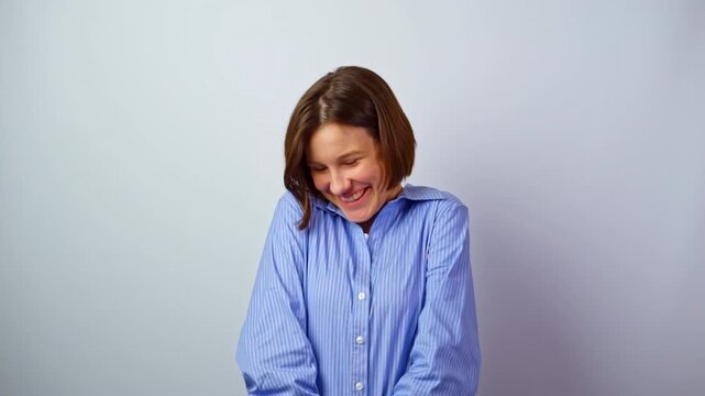 Young shy girl very embarrassed modest from praise timid young woman blushing hiding smile receiving compliment bashful expression studio portrait emotions