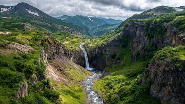 Kamchatka's stunning scenery shows Dangerous Canyon with a waterfall on Vulkannaya River, near Mutnovsky Volcano.