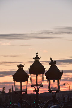 Silhouette of a Paris street lamp against sunset sky at dusk in Paris France, March 2, 2026
