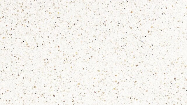 Close-up of a white speckled textured surface, featuring small, irregular brown and gray flecks, ideal for abstract backgrounds, architectural design, or natural stone patterns.