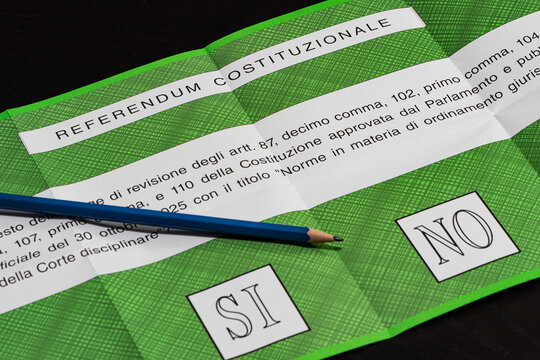 YES and NO on a green ballot paper or slip for Italian popular constitutional referendum concerning the reform of judicial system, with a pencil ready to vote. NO won the referendum 