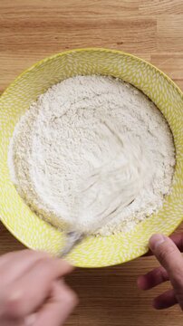 Mixing Flour With Whisk In Bowl Top View