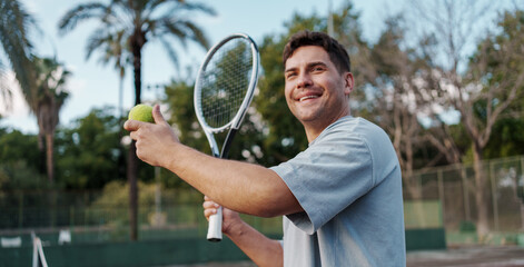 Tennis Player Focuses During Training. Tennis Athlete Readying Powerful Serve In Bright Sunlight