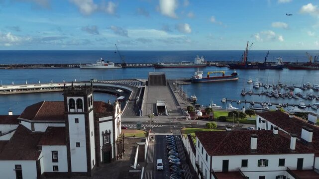 Aerial View of Ponta Delgada Harbour with Cargo Ships, Marina and Iconic Waterfront Plaza in Azores