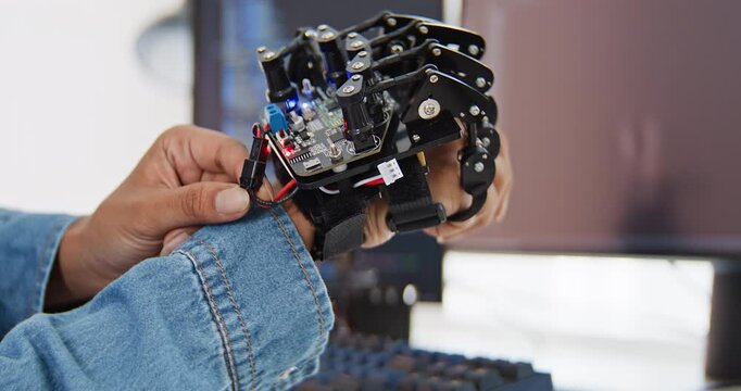 Close up of female engineer developer examine robotic arm with laptop computer at home office. Science and technology, Robot automated innovation, Electrical engineering manufacturing concept