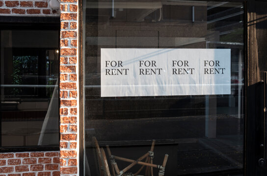 For rent  sign hanging outside a restaurant, store, office or other